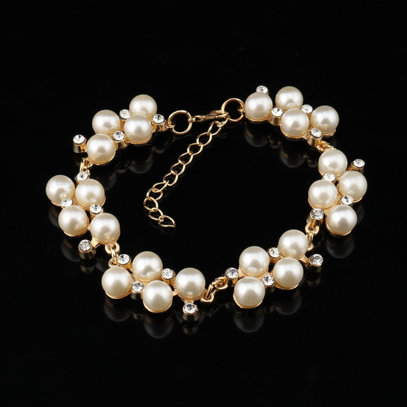 Pearl -cluster en goudkettingarmband