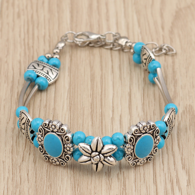 Metalen armband met bloemen